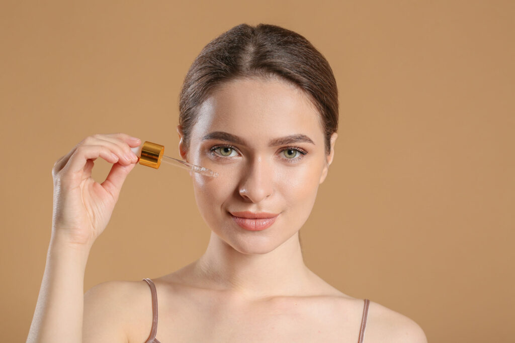 Woman applying skincare serum — AI personalization in beauty industry marketing