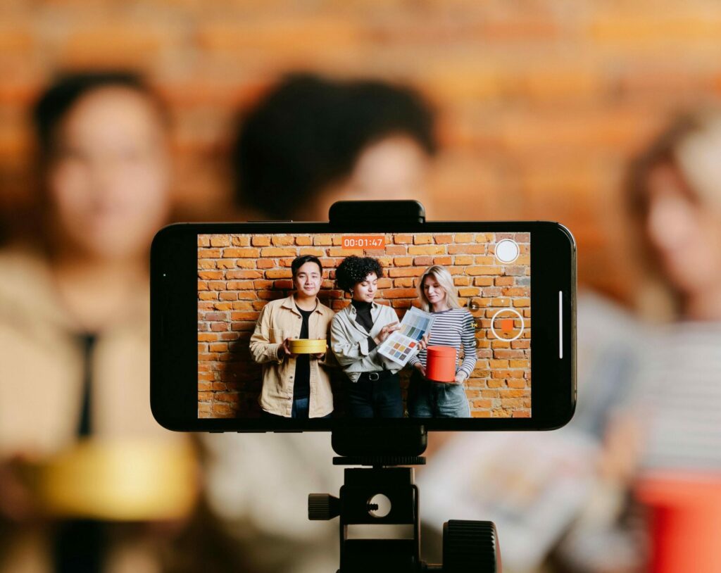 People creating user-generated content for social media with a smartphone