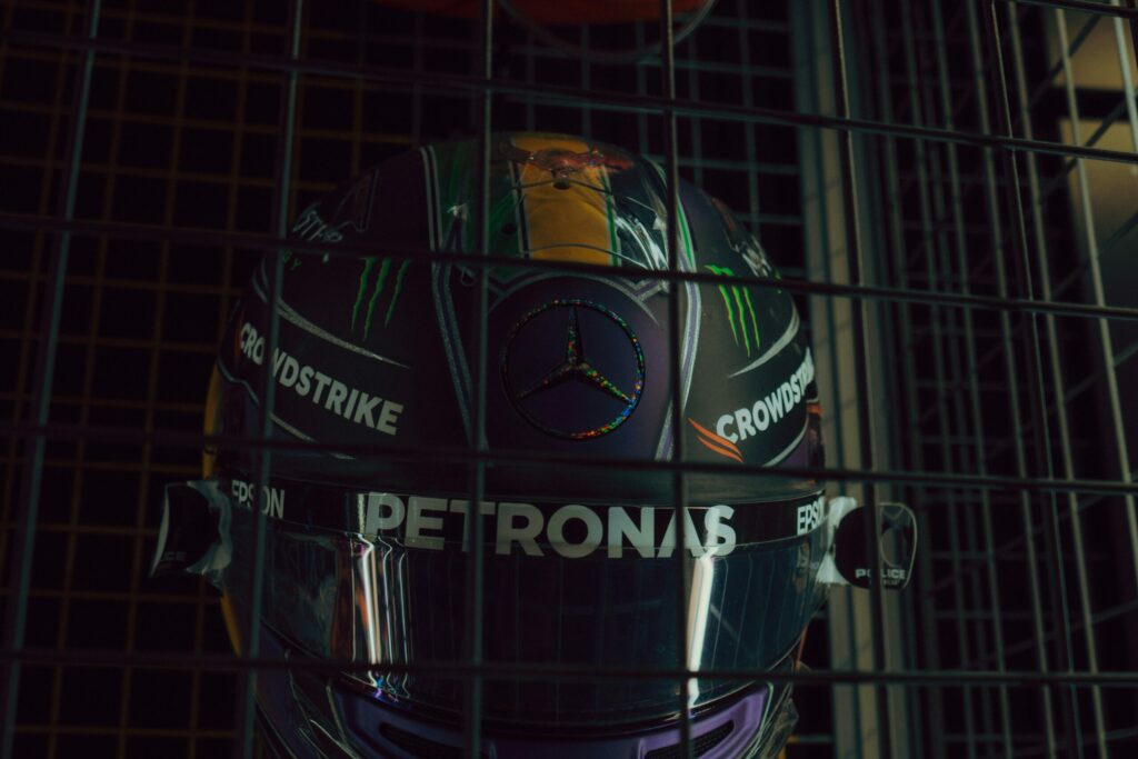 Lewis Hamilton helmet reflecting his influence on Formula 1 digital entertainment.